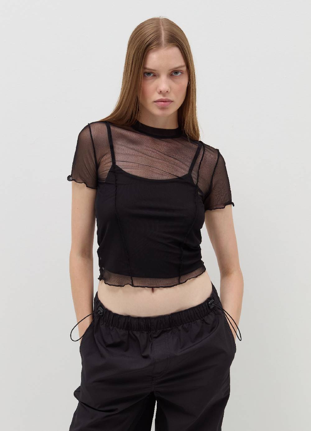 B. ANGEL T-shirt crop in mesh con profili ondulati Prezzo Ridotto
