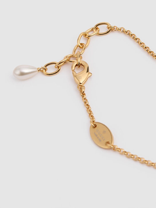 Luisaviaroma Bracciale a catena GG Marmont in ottone con charm Officina
